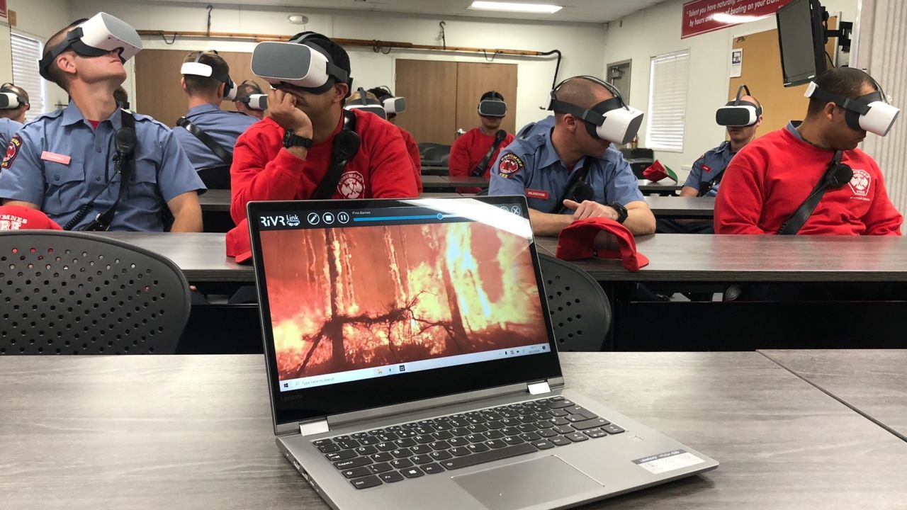 Firefighter trainees from the Cosumnes Fire Department are taught how to handle specific scenarios while wearing VR headsets.