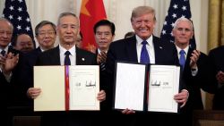 President Donald Trump signs a trade agreement with Chinese Vice Premier Liu He, in the East Room of the White House, Wednesday, Jan. 15, 2020, in Washington. (AP Photo/Evan Vucci)