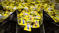 Sealed packets of Nesquik pass through a processing machine during production at the Rossiya chocolate factory in Samara, Russia, on Tuesday, Sept. 16, 2014.