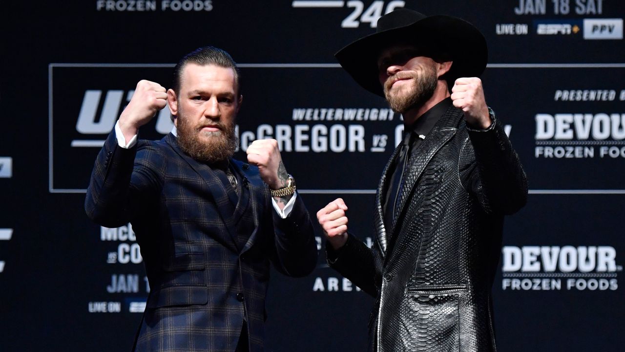 McGregor and Donald Cerrone pose for photos during the UFC 246 press conference.