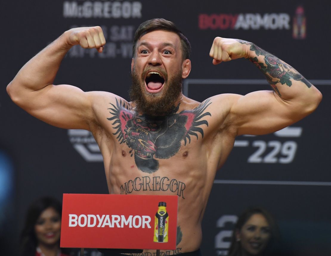 McGregor poses during a weigh-in for UFC 229.