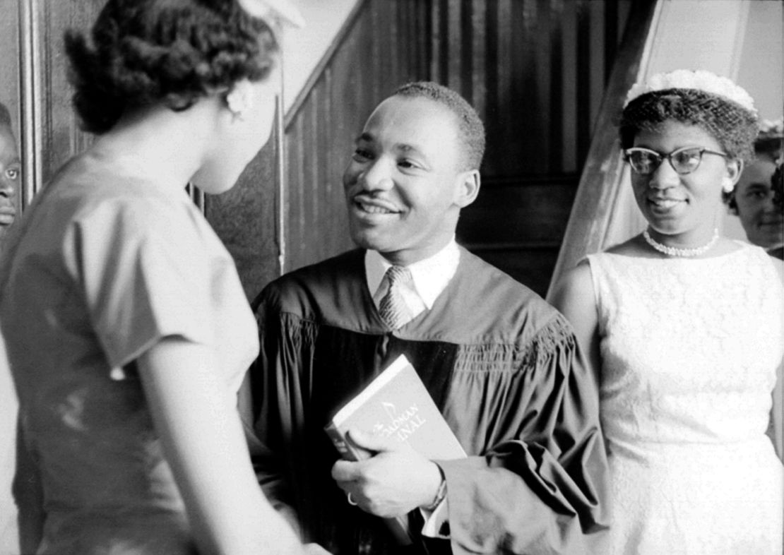 King speaks with people after delivering a sermon on May 13, 1956, in Montgomery, Alabama.