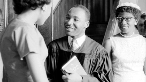 King speaks with people after delivering a sermon on May 13, 1956, in Montgomery, Alabama.