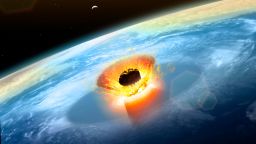 Asteroid impact. Illustration of a large asteroid colliding with Earth on the Yucatan Peninsula in (what is modern day) Mexico. This impact is believed to have led to the death of the dinosaurs some 65 million years ago. The impact formed the Chicxulub crater, which is around 200 kilometres wide. The impact would have thrown trillions of tons of dust into the atmosphere, cooling the Earths climate significantly, which may have been responsible for the mass extinction. A layer of iridium- rich rock, known as the K pg boundary, is thought to be the remnants of the impact debris.