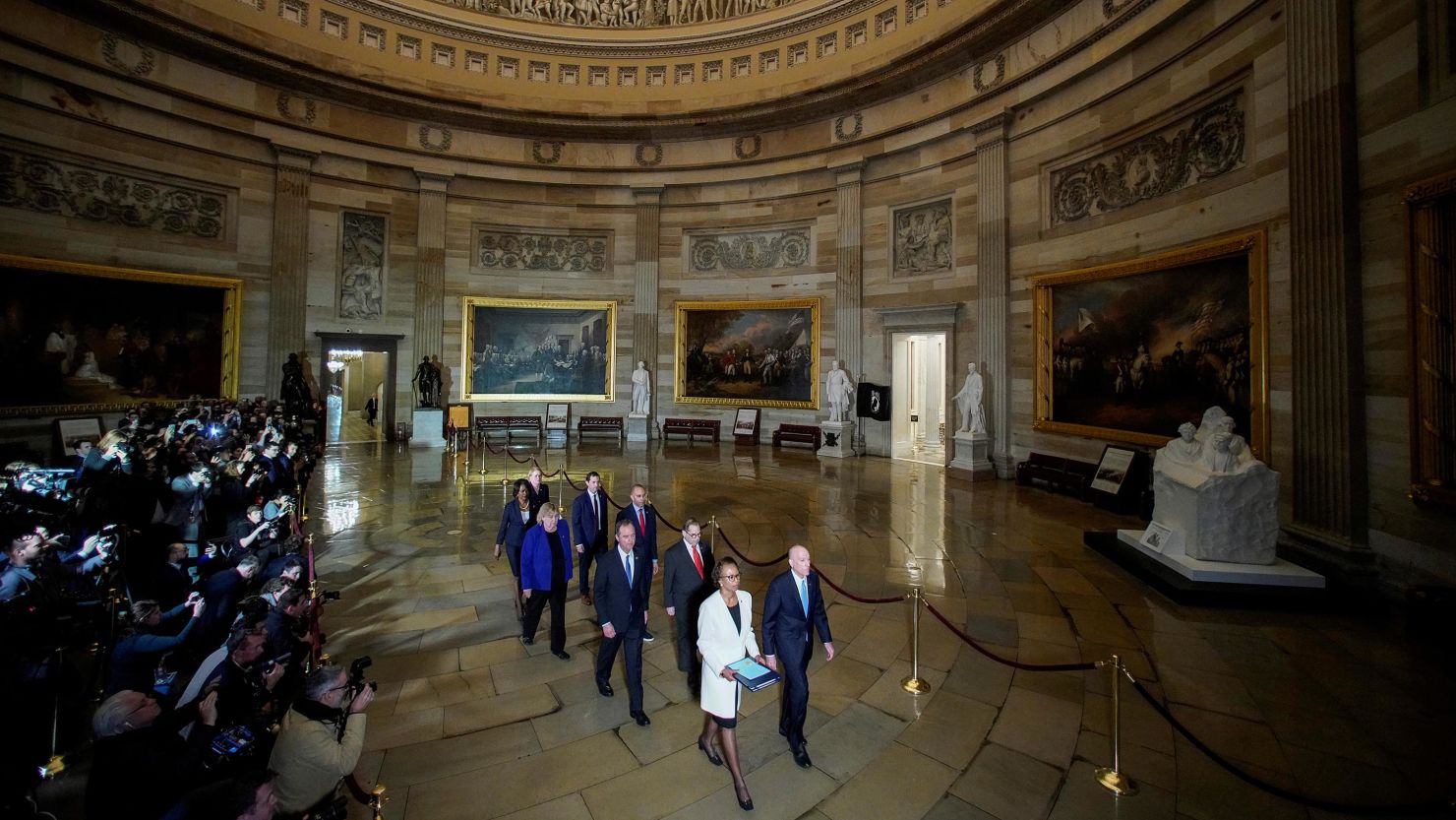 House Sergeant at Arms Paul Irving and House Clerk Cheryl Johnson carry two articles of impeachment against U.S. President Donald Trump during a procession with the seven House impeachment managers through the Rotunda of the U.S. Capitol to the U.S. Senate in Washington, U.S., January 15, 2020.