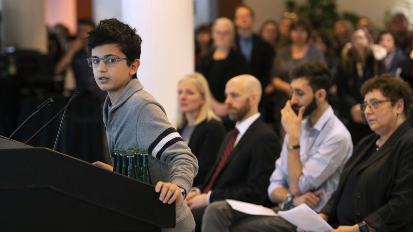 Ryan Pourjam, 13, son of Mansour Pourjam, speaks about his father during a ceremony on Wednesday, Jan. 15, 2020 at Carleton University in Ottawa to honor Pourjam, a biology alumnus, and biology PhD student Fareed Arasteh, who died in the crash of Ukraine International Airlines Flight PS752 in Tehran. (Justin Tang/The Canadian Press via AP)