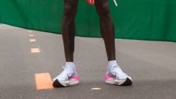 Kenya's Eliud Kipchoge stands after his attempt  to bust the mythical two-hour barrier for the marathon on October 12 2019 in Vienna, - With a time of 1hr 59min 40.2sec, the Olympic champion became the first ever to run a marathon in under two hours in the Prater park with the course readied to make it as even as possible. (Photo by ALEX HALADA / AFP) (Photo by ALEX HALADA/AFP via Getty Images)