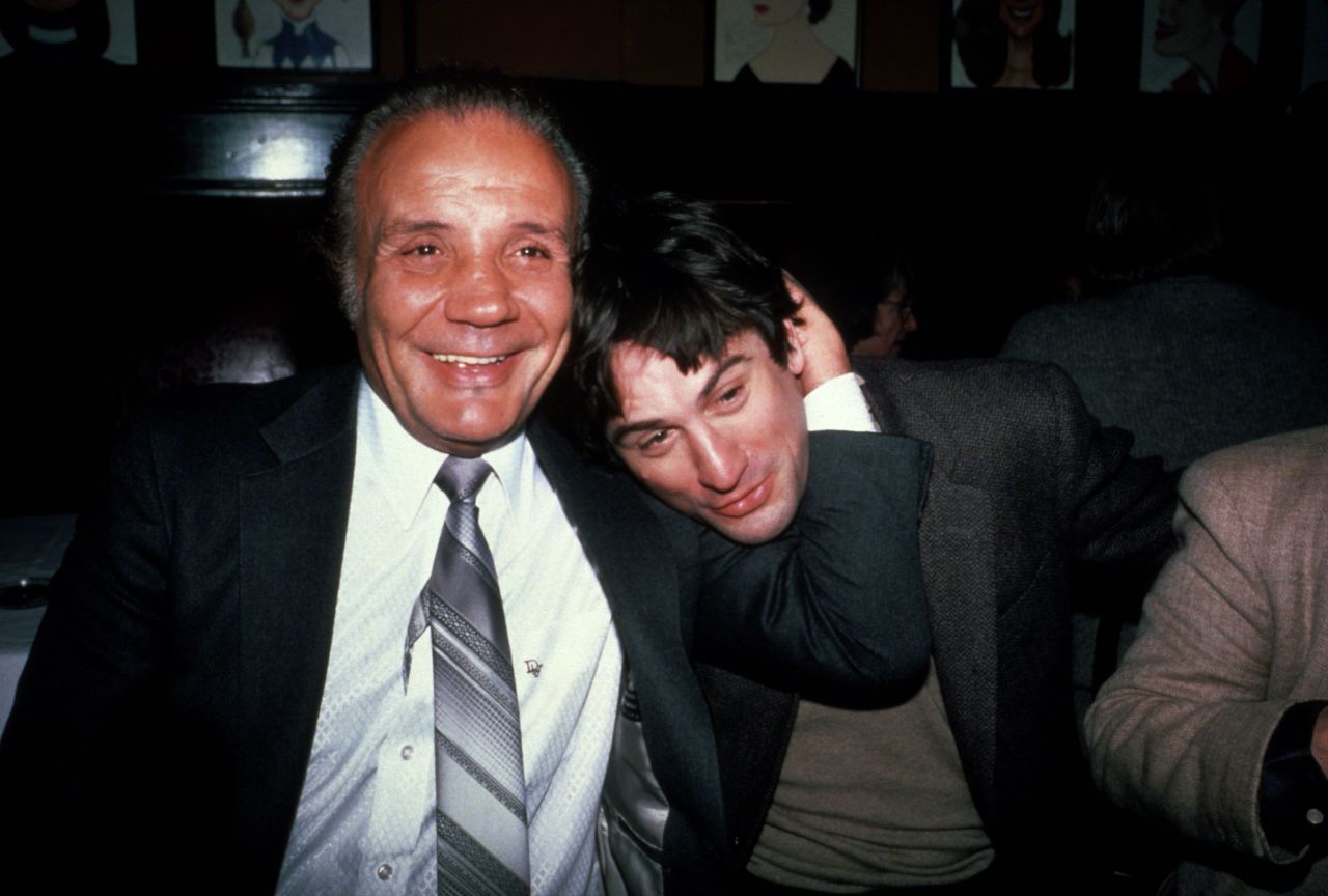 The real-life LaMotta playfully grabs De Niro at Sardi's restaurant in New York City.