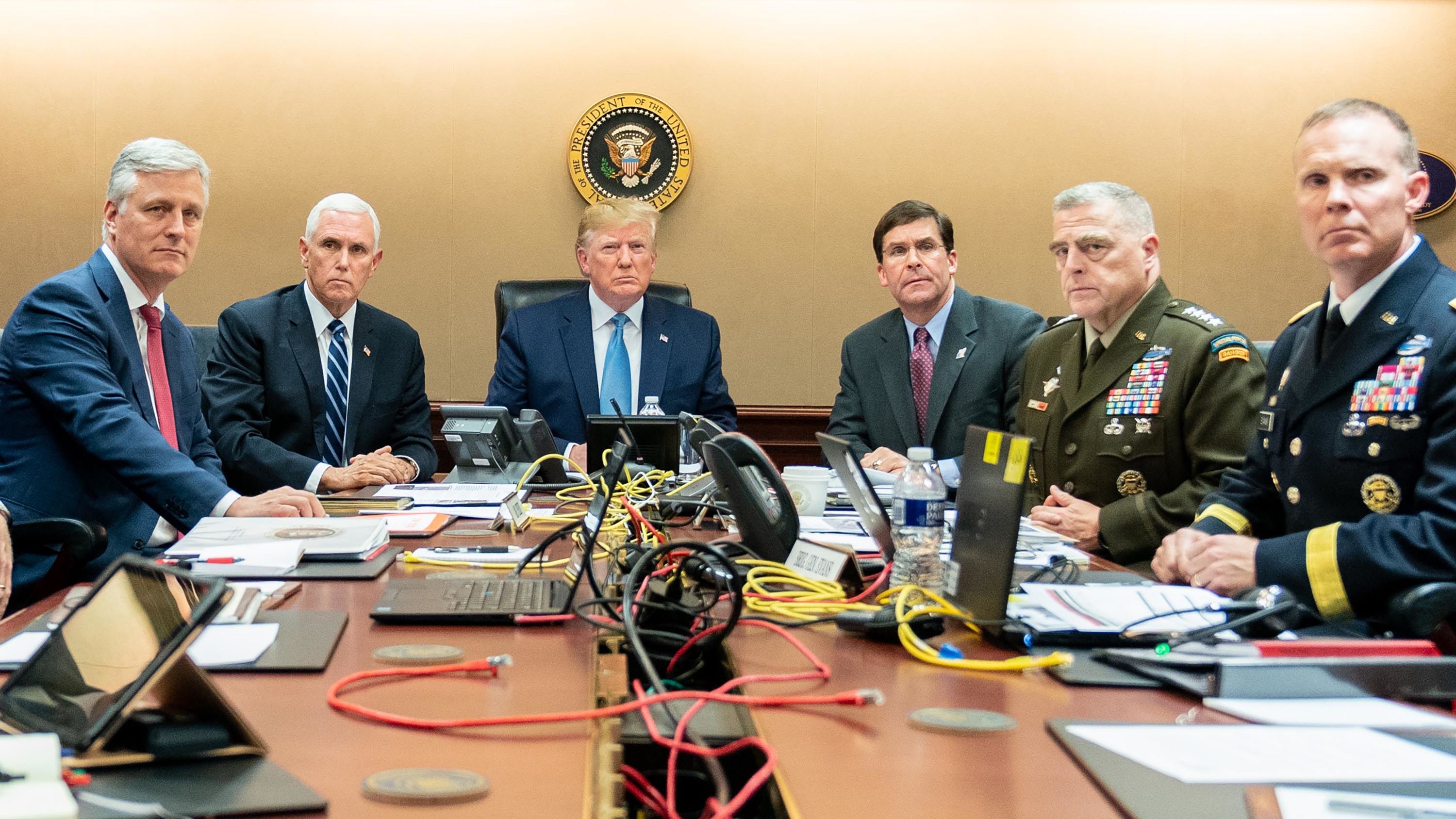 In this photo released by the White House, President Trump sits in the White House Situation Room, monitoring developments in the October 2019 military raid that killed ISIS leader Abu Bakr al-Baghdadi in northwest Syria. From left are national security adviser Robert O'Brien; Pence; Trump; Defense Secretary Mark Esper; Gen. Mark Milley, the chairman of the Joint Chiefs of Staff; and Brig. Gen. Marcus Evans, the deputy director for special operations on the Joint Staff.