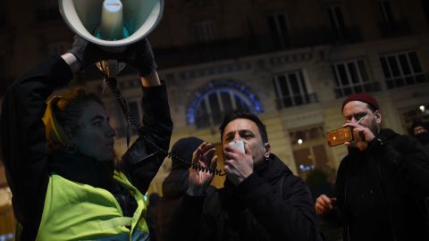 A protestor speaks in a megaphone during a demonstration in front of the Bouffes du Nord theatre in Paris on January 17, 2020 as French President attends a play. - Protestors demonstrate against French President policy including the pension reform. (Photo by Lucas BARIOULET / AFP) (Photo by LUCAS BARIOULET/AFP via Getty Images)