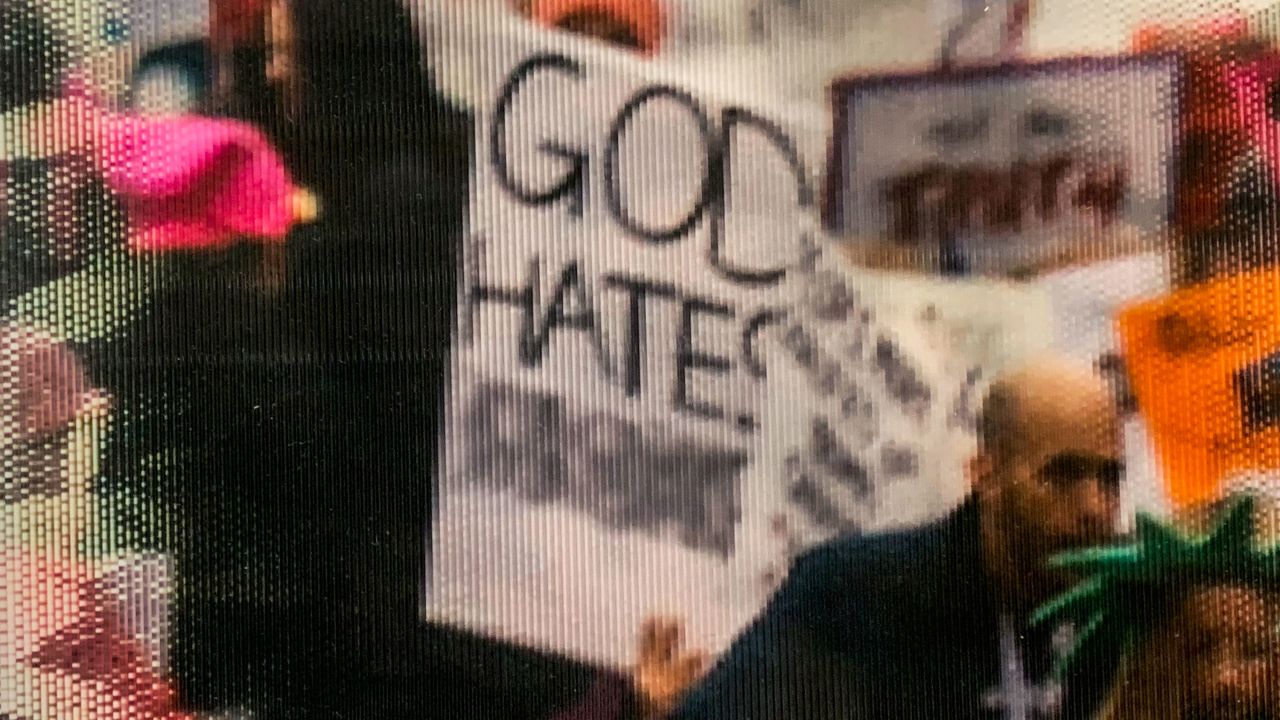 A close up on the altered sign in the photograph from Women's March in 2017 is seen on display at the National Archives Research Center on Friday, January 17, 2020 in Washington, DC.