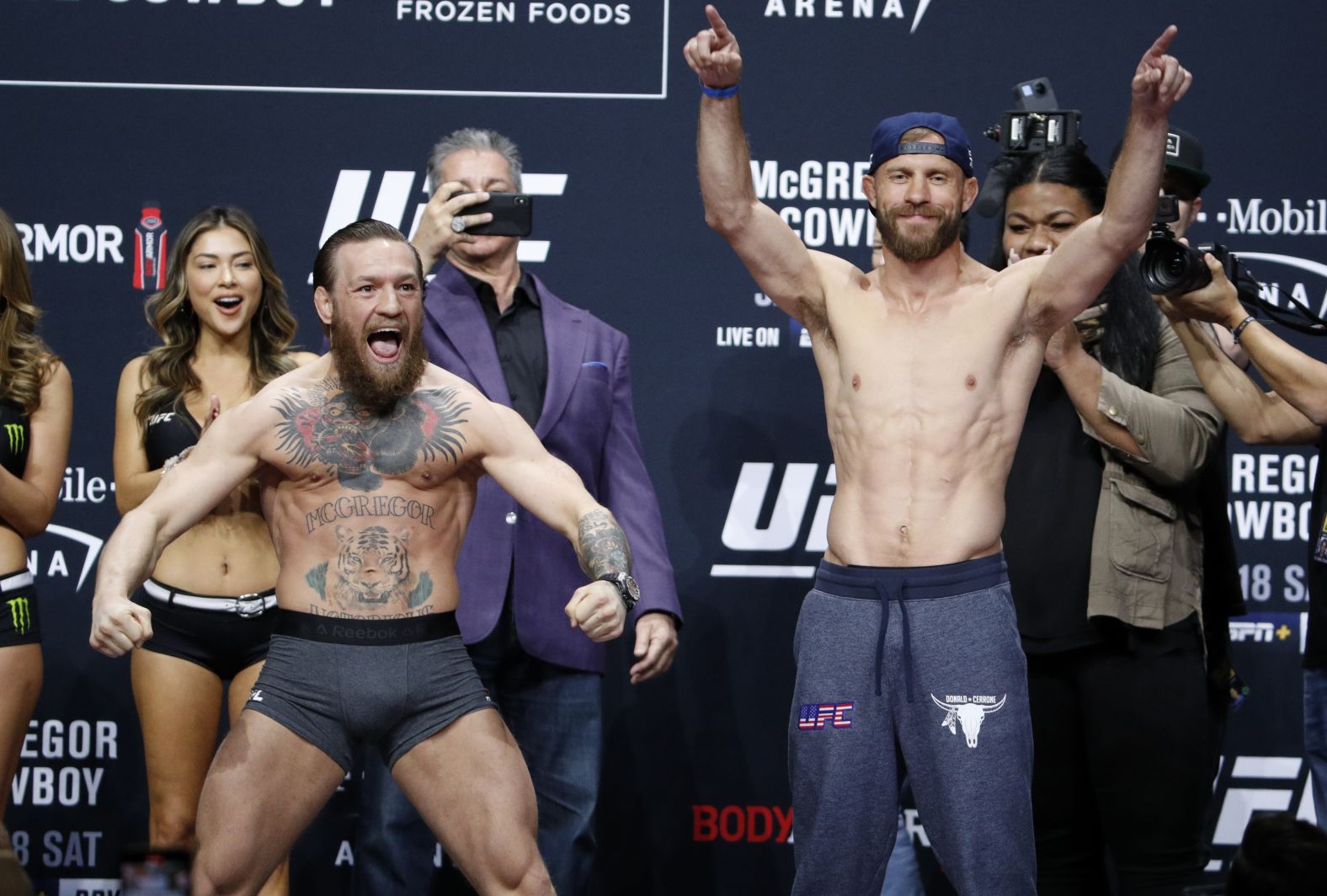 McGregor, left, and Cerrone pose during a ceremonial weigh-in for a UFC 246 welterweight mixed martial arts bout Friday in Las Vegas.