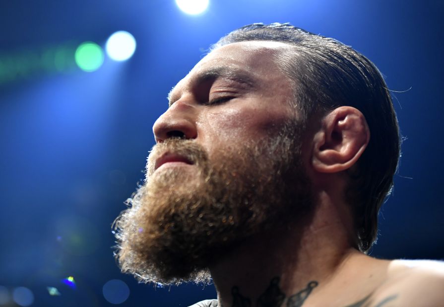 McGregor is seen with his eyes closed after arriving on the octagon. 