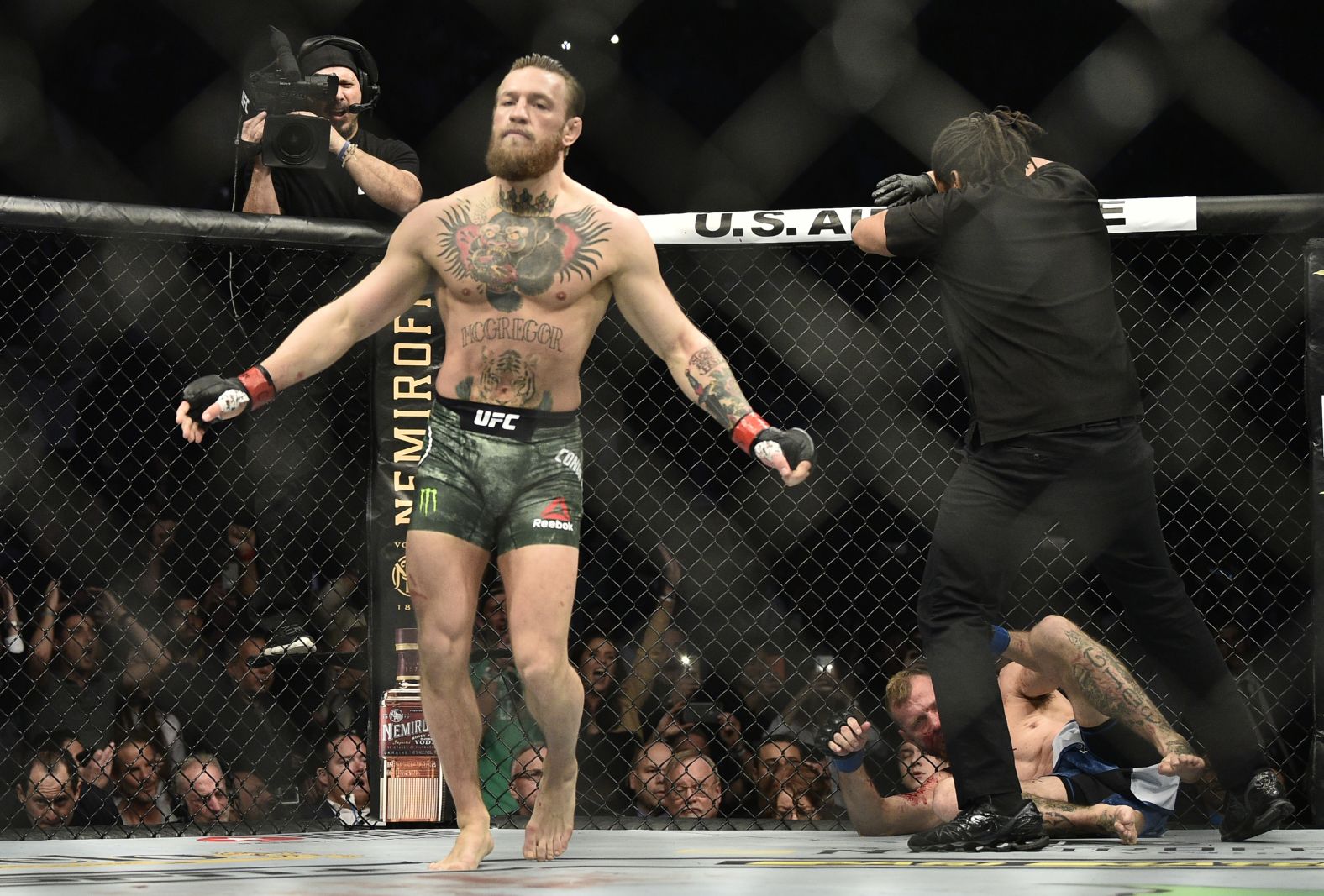 McGregor walks away after knocking out Cerrone in their welterweight fight.