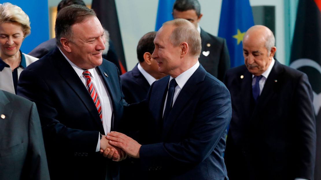 US Secretary of State Mike Pompeo, left, with Russian President Vladimir Putin in Berlin on Sunday. 