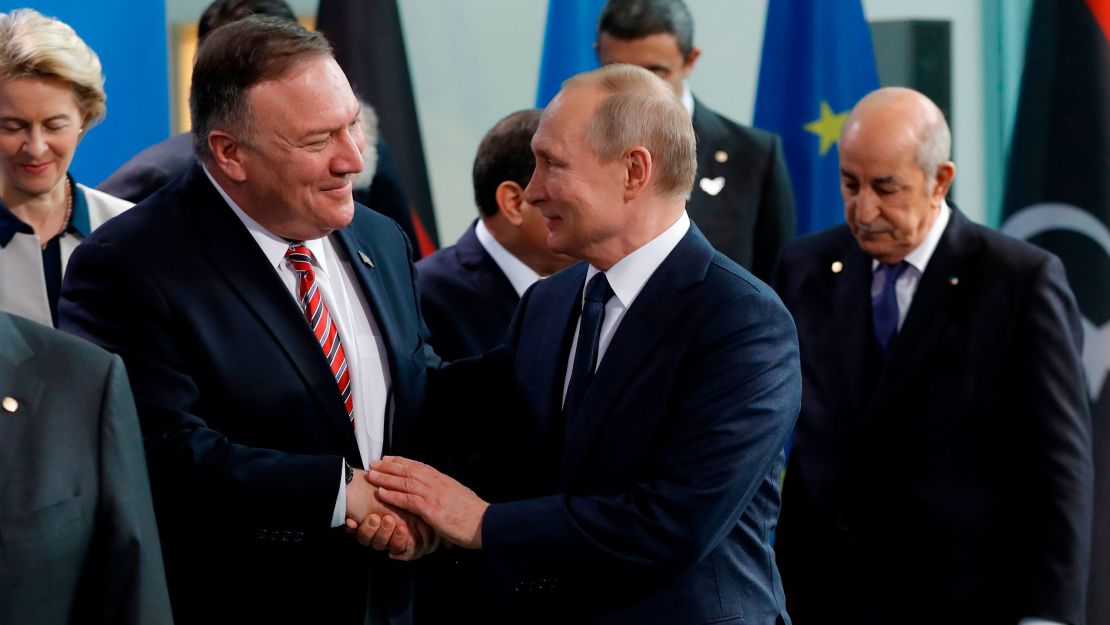 US Secretary of State Mike Pompeo, left, with Russian President Vladimir Putin in Berlin on Sunday.