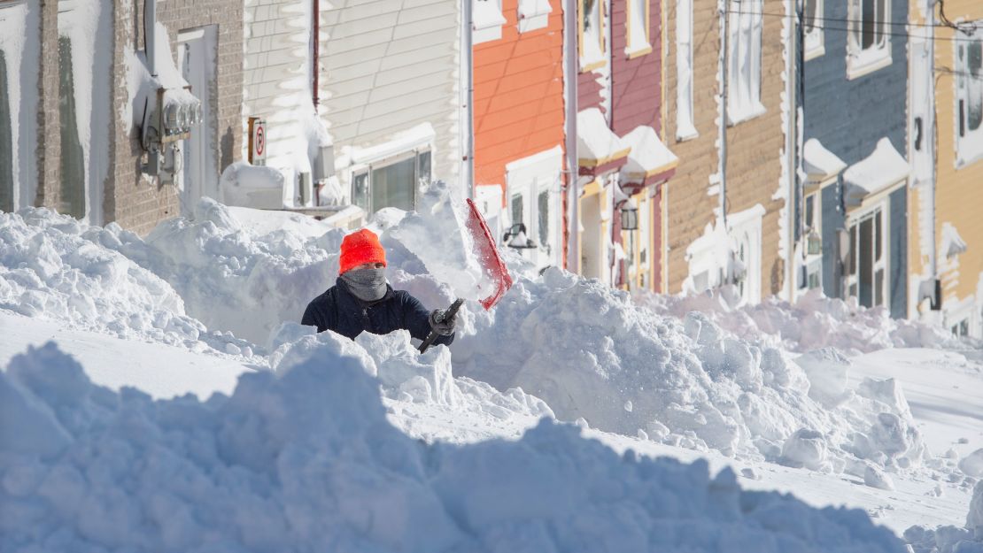 A resident digs out his walkway in St. John's, Newfoundland, on Saturday.