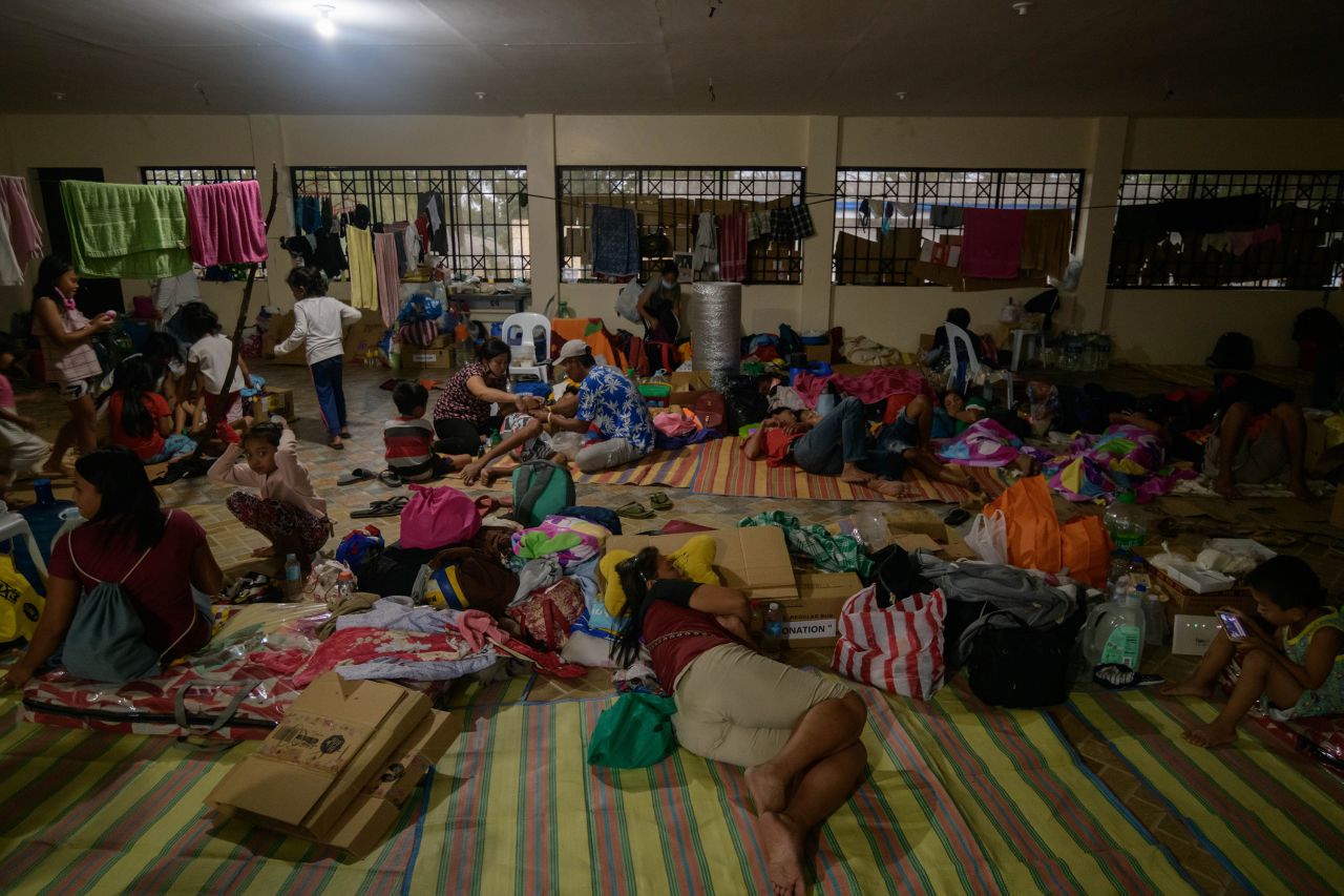 Evacuees rest at a government complex used as an evacuation center in Tagaytay on January 18.