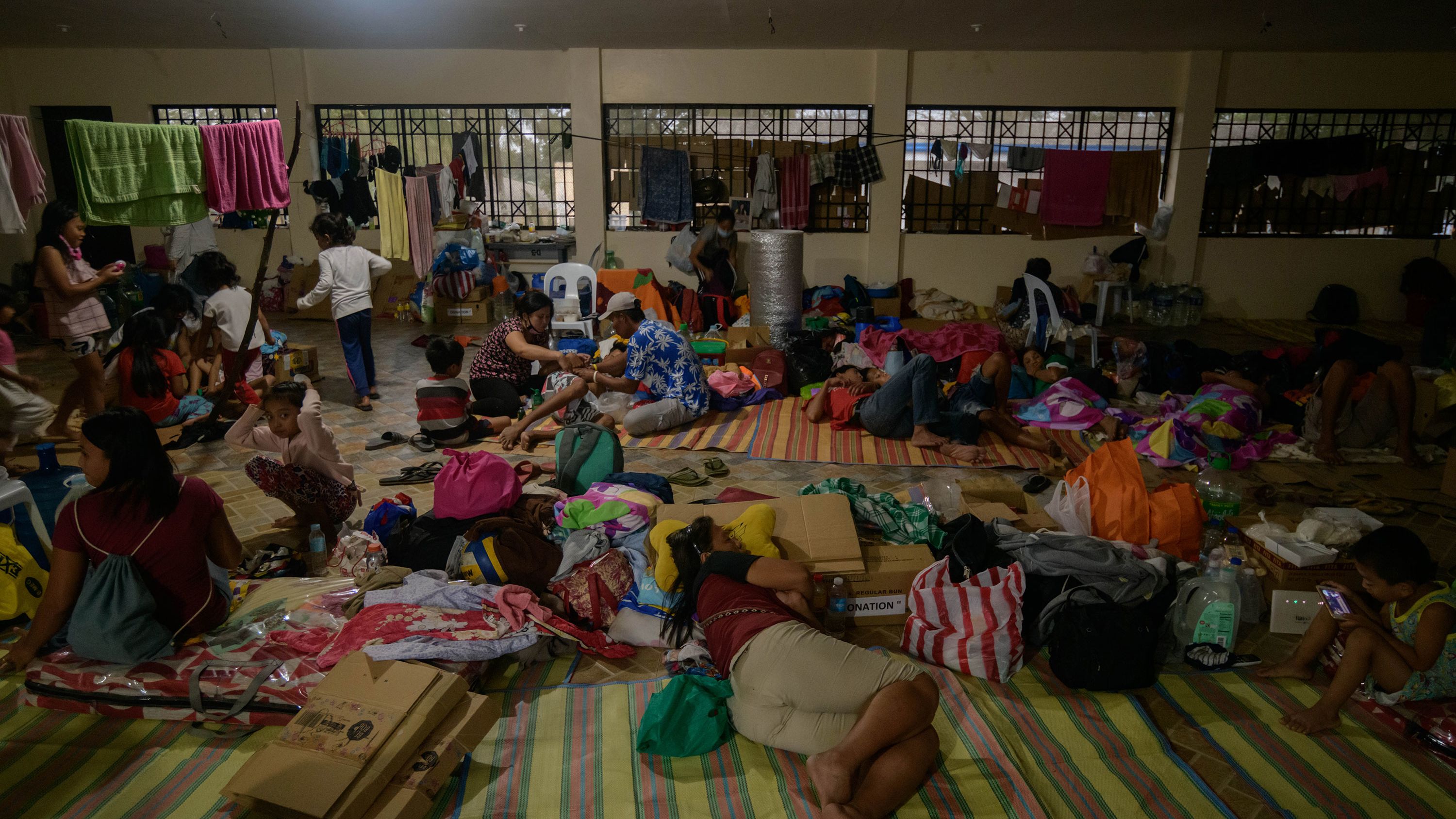 Evacuees rest at a government complex used as an evacuation center in Tagaytay on January 18.