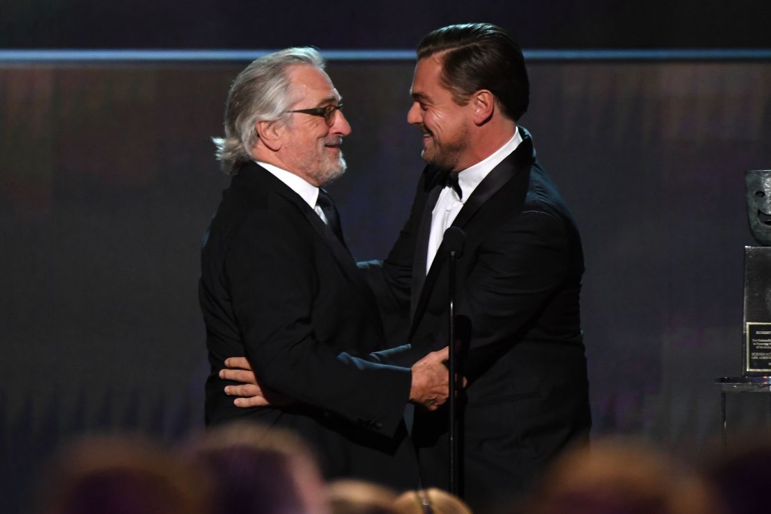 Leonardo DiCaprio (R) presents Robert De Niro the SAG Life Achievment Award (Photo by Robyn Beck / AFP) (Photo by ROBYN BECK/AFP via Getty Images)