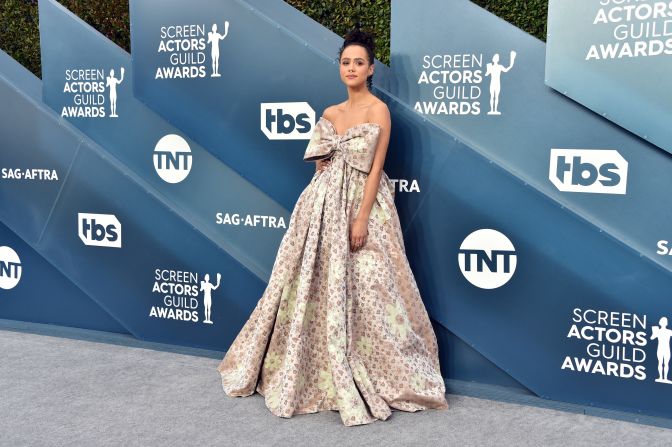 "Game of Thrones" actress Nathalie Emmanuel attends SAG Awards in a strapless Miu Miu gown with an oversized bow. 