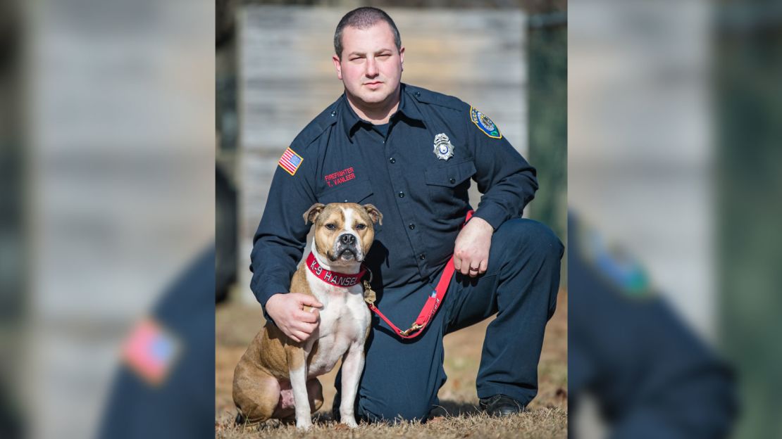 Hansel and his handler, Tyler Van Leer.