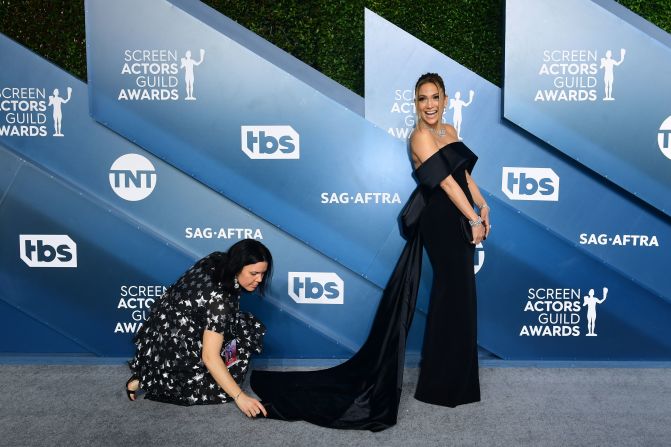 "Hustlers" actress Jennifer Lopez arrived to the silver carpet in a black off-shoulder gown with an elegant train. The dress was created by  Lebanese designer Georges Hobeika.