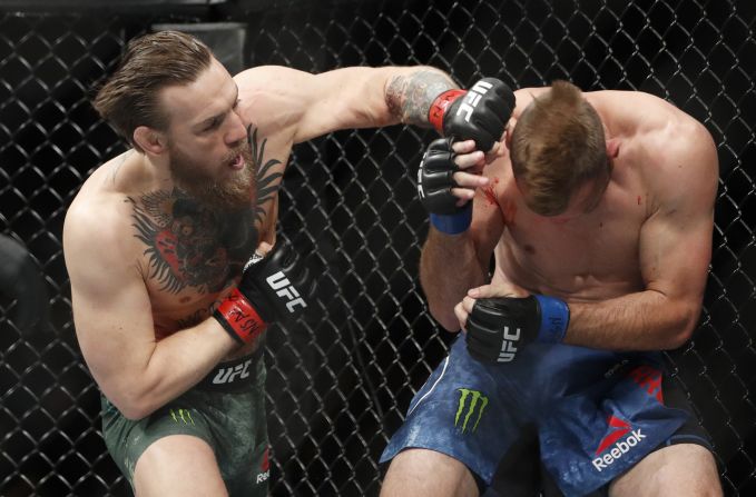 Irish mixed martial arts fighter <a href="index.php?page=&url=https%3A%2F%2Fwww.cnn.com%2F2020%2F01%2F19%2Fsport%2Fgallery%2Fufc-246-mcgregor-cerrone%2Findex.html" target="_blank">Conor McGregor hits Donald "Cowboy" Cerrone</a> during their UFC 246 welterweight mixed martial arts bout on Saturday, January 18. McGregor won the fight in less than a minute, <a href="index.php?page=&url=https%3A%2F%2Fwww.cnn.com%2F2020%2F01%2F19%2Fsport%2Fufc-246-vegas-fight-mcgregor-cerrone%2Findex.html" target="_blank">his first UFC match in fifteen months.</a>