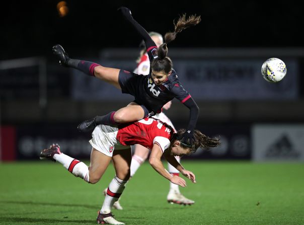 Brooke Chaplen of Reading battles for possession with Jennifer Beattie of Arsenal during the FA Women's Continental League Cup quarter final match on Wednesday, January 15, in Borehamwood, England.