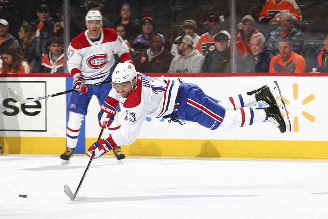 Max Domi of the Montreal Canadiens reaches for the puck during a match against the Philadelphia Flyers on Thursday, January 16, in Philadelphia, Pennsylvania.