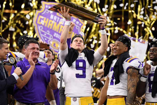 LSU quarterback Joe Burrow lifts the trophy after the LSU Tigers defeated Clemson in the College Football Playoff National Championship on Monday, January 13, in New Orleans, Louisiana. <a target="_blank">See more photos from the game</a>