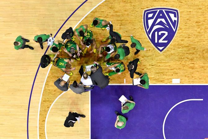 The Oregon Ducks strategize during a timeout in a game against the Washington Huskies on Saturday, January 18, in Seattle, Washington. The Oregon Ducks defeated the Washington Huskies 64-61 in overtime.