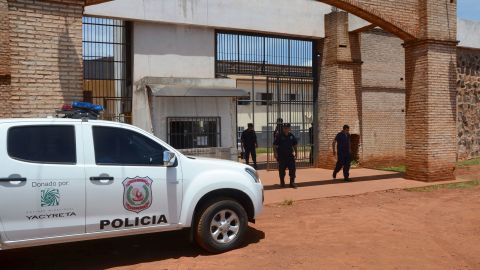 Police mount guard at Pedro Juan Caballero city jail entrance in Paraguay, Sunday, Jan. 19, 2020. Dozens of inmates escaped from this prison early morning, mostly of Brazil's criminal group PCC, "Capital First Command."