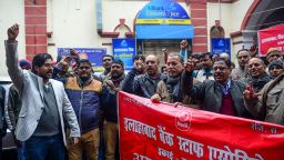 Members of All India Bank Employees Association (AIBEA) shout slogans during a nationwide general strike called by trade unions aligned with opposition parties to protest against the Indian government's economic policies, in Allahabad on January 8, 2020. - Millions went on strike throughout India on January 8, unions said, as workers angry at the government's labour policies brought travel chaos across the country. (Photo by SANJAY KANOJIA / AFP) (Photo by SANJAY KANOJIA/AFP via Getty Images)