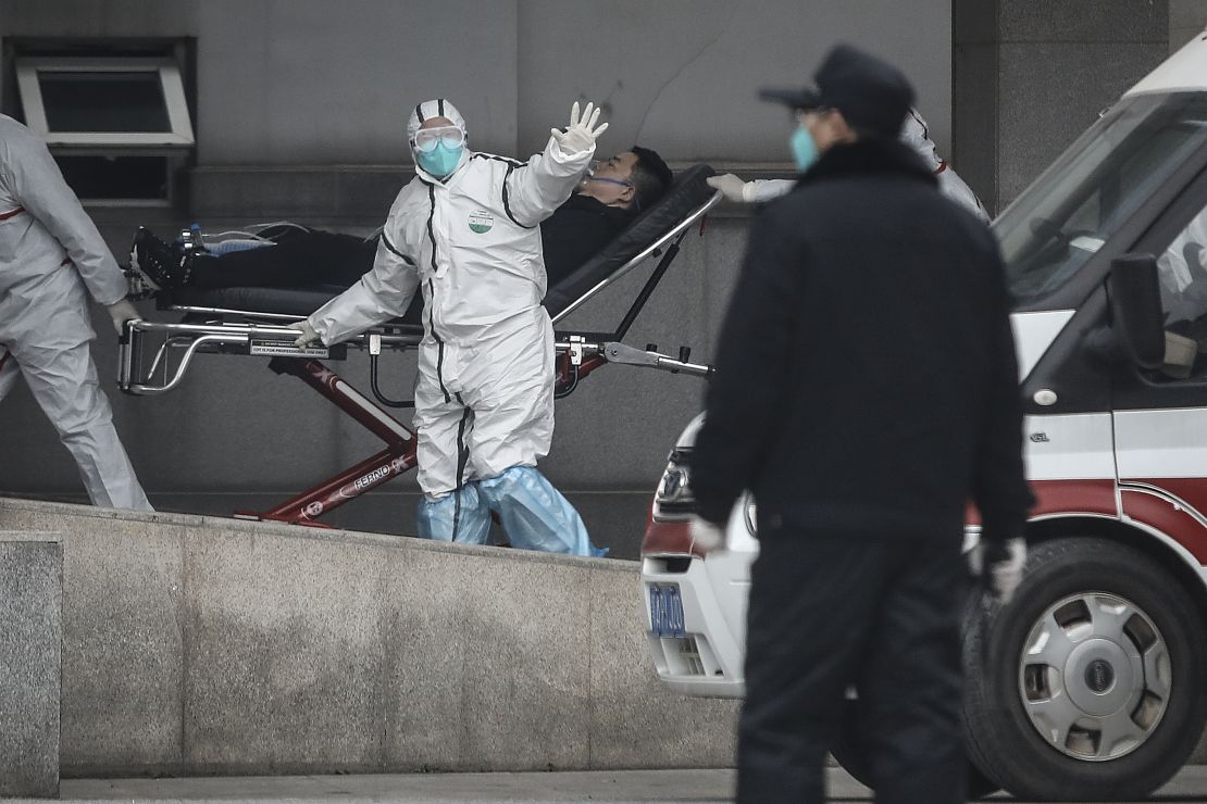 Medical staff transfer patients to Jin Yintan hospital on January 17, 2020 in Wuhan, China.