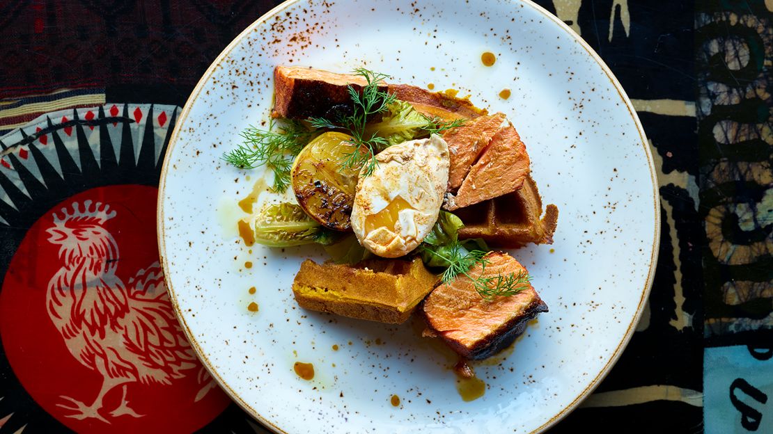 Marcus Samuelsson's Berbere-Smoked Salmon with Sweet Potato Waffles incorporates Ethiopian flavors and spices.
