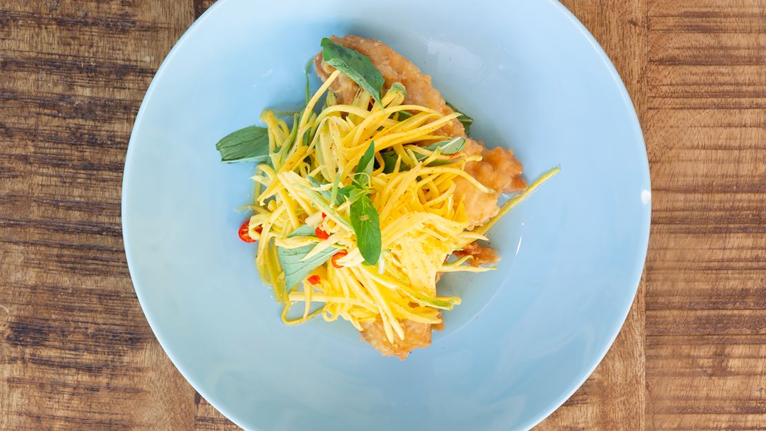 Fried Fish Fillets with Mango Salad (Trei Jien) from Nite Yun are a part of the chef's history.