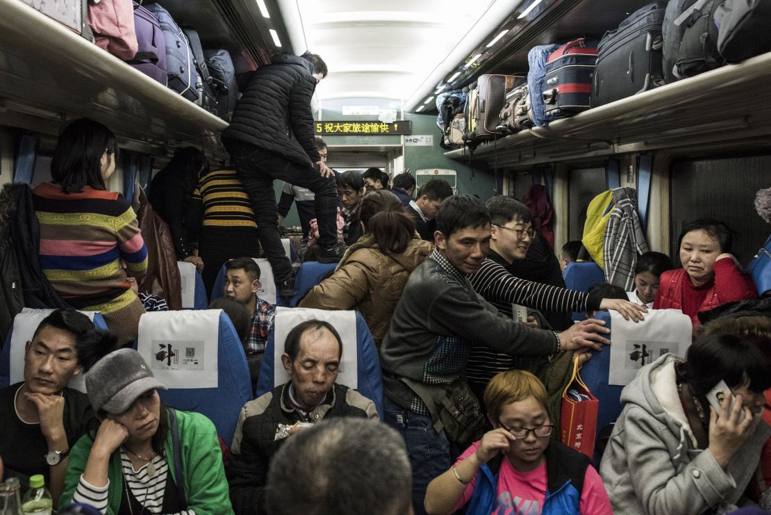 This photo taken on February 10, 2018 shows passengers travelling on a crowded train during the 26-hour journey from Beijing to Chengdu, as they head home ahead of the Lunar New Year.