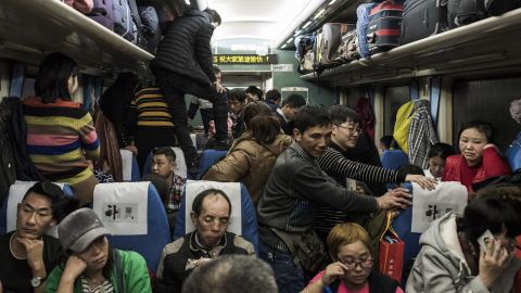 This photo taken on February 10, 2018 shows passengers travelling on a crowded train during the 26-hour journey from Beijing to Chengdu, as they head home ahead of the Lunar New Year.