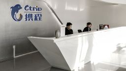 Employees sit at the reception area of Ctrip.com International Ltd. at the company's headquarters in Shanghai, China, on Monday, Jan. 23, 2017.
