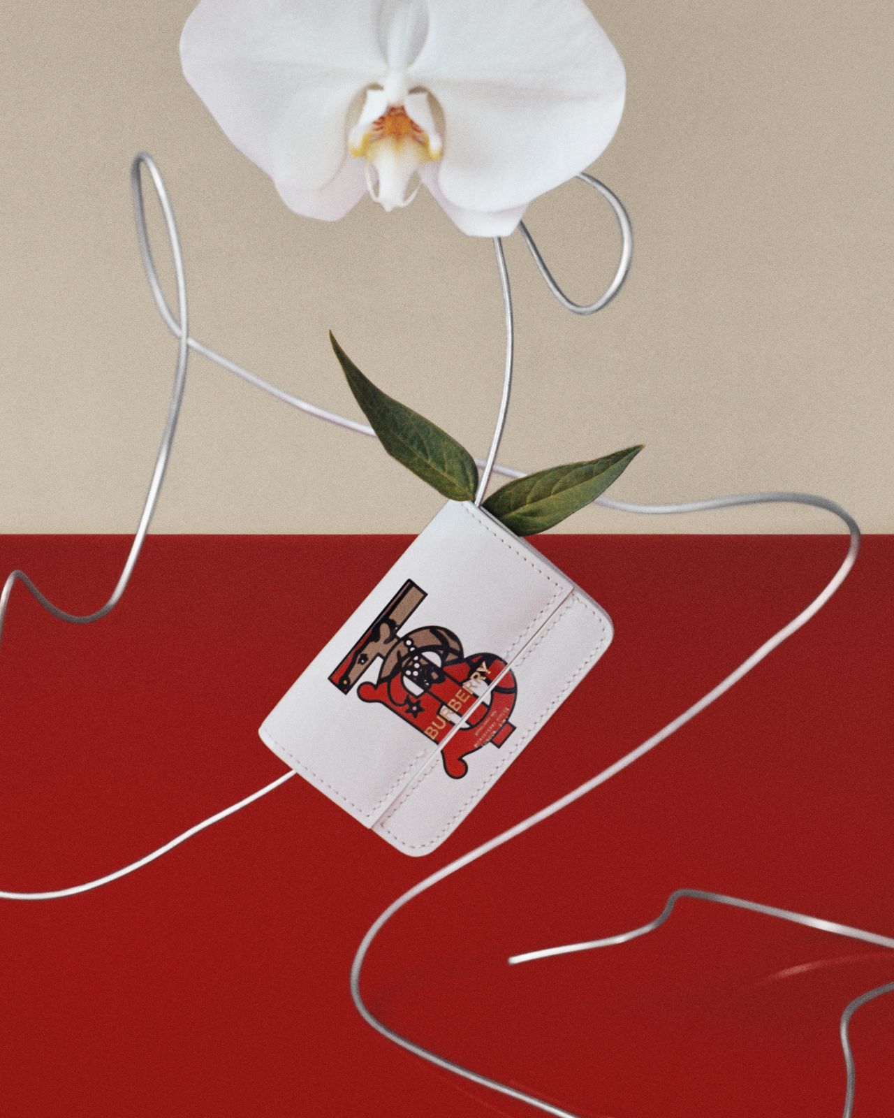 Burberry's rat character, Ratberry, hidden in a monogrammed leather card case.