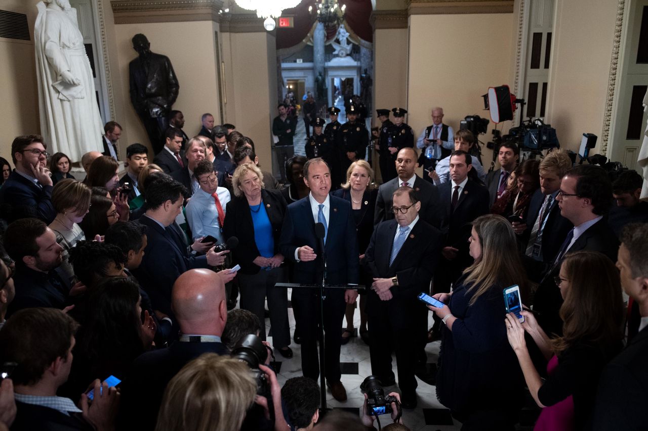 Schiff, at the microphone, addresses the media on January 21 with fellow House impeachment managers.