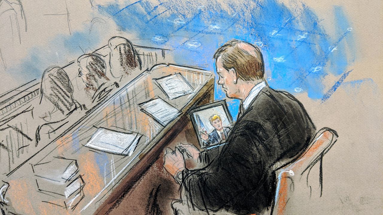 Chief Justice John Roberts presides over the Senate impeachment trial, and views a screen showing video evidence, January 21, 2020.