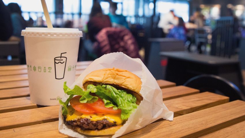 CHICAGO, IL - JANUARY 28:  In this photo illustration a cheeseburger and drink is served up at a Shake Shack restaurant on January 28, 2015 in Chicago, Illinois. The burger chain, with currently has 63 locations, is expected to go public this week with an IPO priced between $17 to $19 a share. The company will trade on the New York Stock Exchange under the ticker symbol SHAK.  (Photo Illustration by Scott Olson/Getty Images)