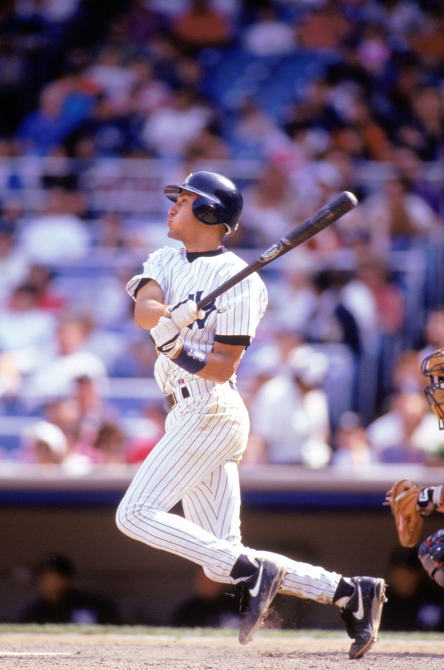 Jeter watches the ball's flight during an at-bat with the Yankees in 1995. After spending a couple of years in the minor leagues, Jeter was called up to the majors on May 29, 1995.