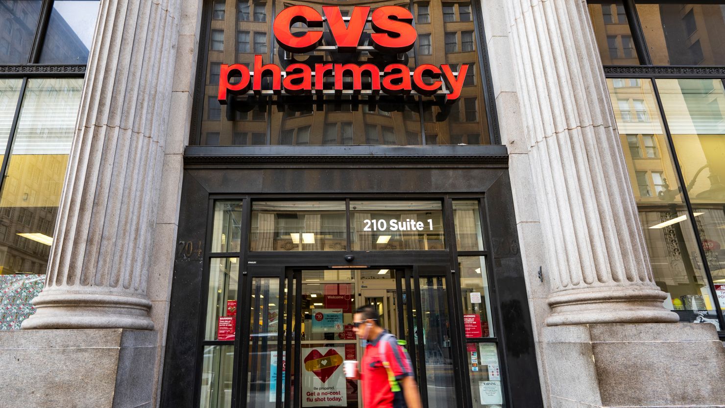 A pedestrian walks past a CVS Pharmacy in Los Angeles. (Photo credit should read Ronen Tivony / Echoes Wire / Barcroft Media via Getty Images)