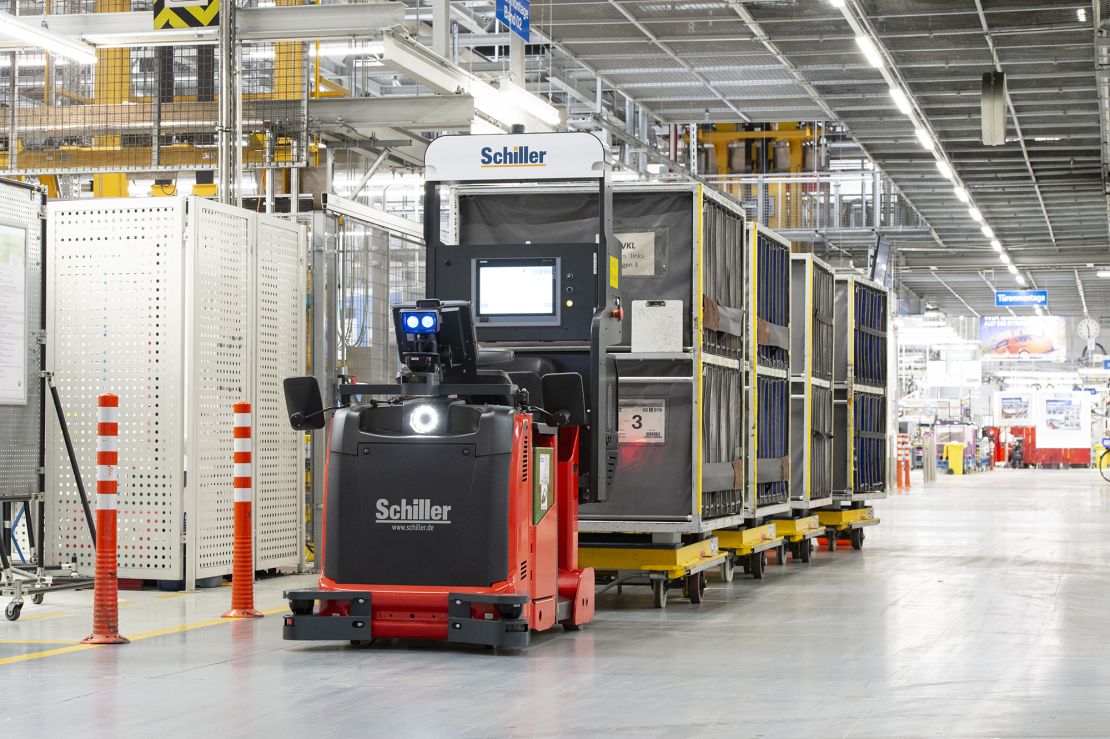 Autonomous vehicles deliver parts around the factory.