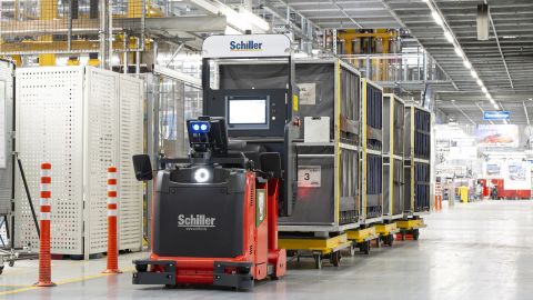 Autonomous vehicles deliver parts around the factory.