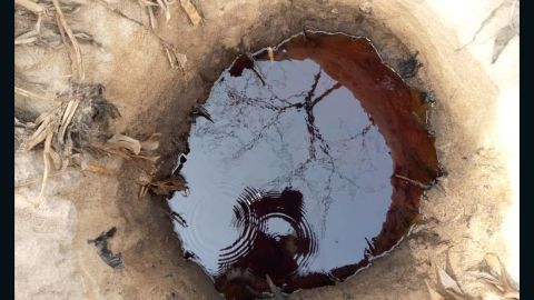 A pit used to siphon oil from pipelines in Kamaru community in Lagos, according to the Nigerian navy.