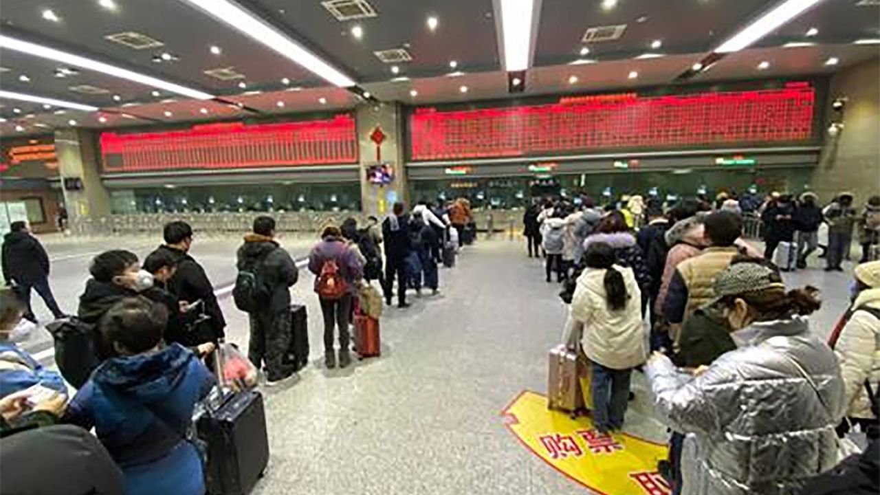 People in a ticket line trying to get out of Wuhan in Wuchang train station in China.